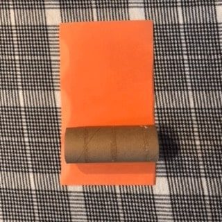 red-fox-craft-step1 Wrap your toilet paper roll in orange construction paper. Glue it down so it stays in place.