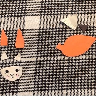 red-fox-craft-step3 Cut out all the pieces you’ll need for your fox like the tail, ears, and face! Make sure you have two pieces for each ear (orange and white), and three for the tail (orange, white, and black). You can decorate the face however you like!