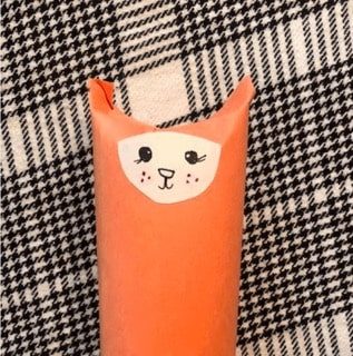 red-fox-craft-step4 Glue your cute fox face onto the toilet paper roll.