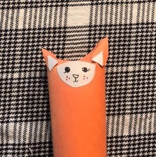 red-fox-craft-step6 Glue the ears on to the pointy parts of the folded toilet paper roll.
