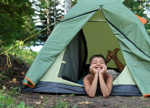 boy in camping tent