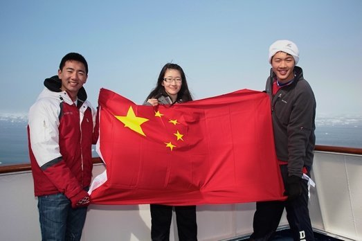 Students on Ice youth holding Chinese flag students on Ice, youth, arctic, chinese flag