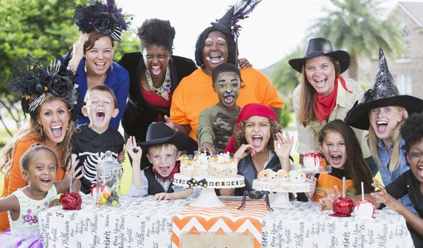 Group of mothers and children at Halloween party