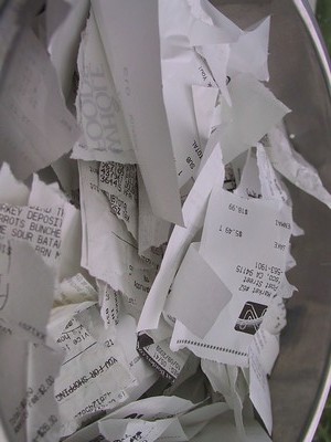 A pile of receipts that are all torn up